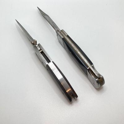 LOT 76: Pair of Folding Knives with Leather Sheaths