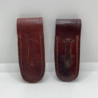 LOT 76: Pair of Folding Knives with Leather Sheaths