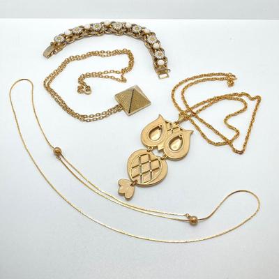 LOT 81: Vintage Gold Tone Jewelry Collection - Talisman Guild 1976 Pyramid Pendant Necklace, Articulated Owl Necklace,