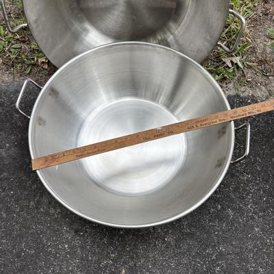 LOT 93: Stainless Steel Cookware Collection: Flatbottom Pan/Wok (2), Juicer Pot Made in Finland, Poacher/Steamer Pots