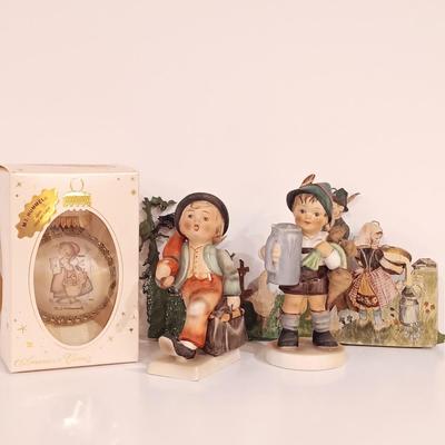 LOT 113: Hummel Goebel Merry Wanderer and For Father Figurines with Hummel Ornament & Painted Wood Die Cuts