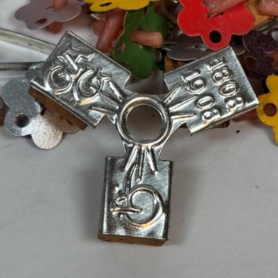 LOT 223: Lovely Vintage Collection of What Nots: St. Peter Nacht Lichte, Germany Floating Candles, Baby Spoons, Crumb Sweeper, Clothing...