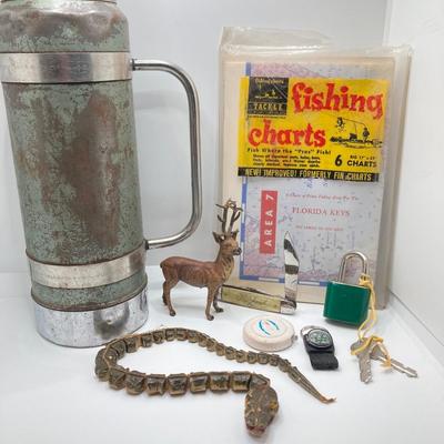 LOT 186: Vintage Sporting Goods Collection - Cast Iron Reindeer / Buck Figurine Made in Germany, Articulated Snake, Fishing Charts,...