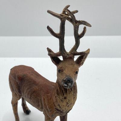 LOT 186: Vintage Sporting Goods Collection - Cast Iron Reindeer / Buck Figurine Made in Germany, Articulated Snake, Fishing Charts,...