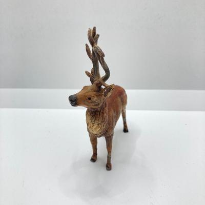 LOT 186: Vintage Sporting Goods Collection - Cast Iron Reindeer / Buck Figurine Made in Germany, Articulated Snake, Fishing Charts,...