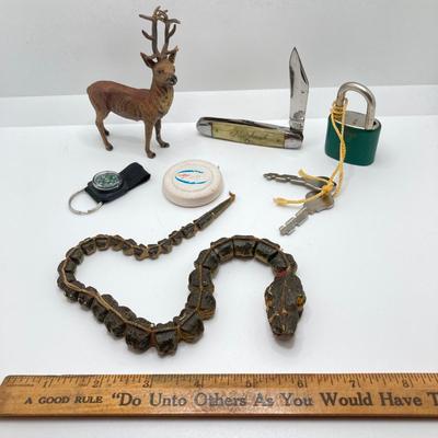 LOT 186: Vintage Sporting Goods Collection - Cast Iron Reindeer / Buck Figurine Made in Germany, Articulated Snake, Fishing Charts,...