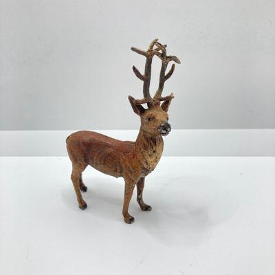 LOT 186: Vintage Sporting Goods Collection - Cast Iron Reindeer / Buck Figurine Made in Germany, Articulated Snake, Fishing Charts,...