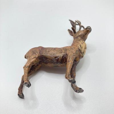 LOT 186: Vintage Sporting Goods Collection - Cast Iron Reindeer / Buck Figurine Made in Germany, Articulated Snake, Fishing Charts,...