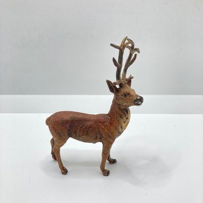 LOT 186: Vintage Sporting Goods Collection - Cast Iron Reindeer / Buck Figurine Made in Germany, Articulated Snake, Fishing Charts,...