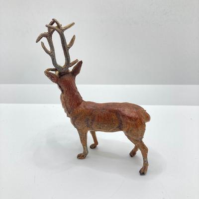 LOT 186: Vintage Sporting Goods Collection - Cast Iron Reindeer / Buck Figurine Made in Germany, Articulated Snake, Fishing Charts,...