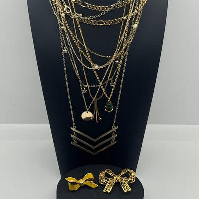 LOT 169J: Assorted Goldtone Necklaces PLUS Two Bow Pins: Avon and More!