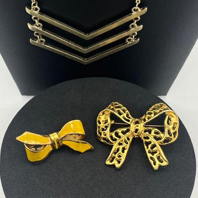 LOT 169J: Assorted Goldtone Necklaces PLUS Two Bow Pins: Avon and More!