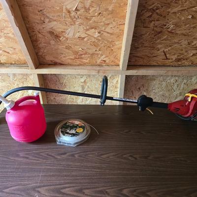 26cs Homelite weeder with extra string and 1 1/4 gas can
