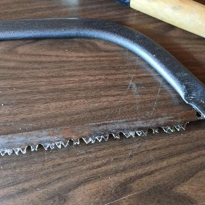 Electric weed eater, Loppers, and a bow saw