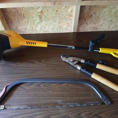 Electric weed eater, Loppers, and a bow saw
