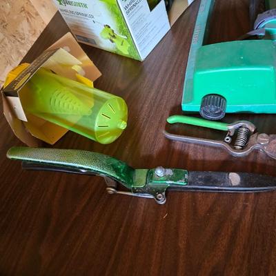 Yard / garden sprinklers and handtools with a bunch of vegetable seeds (some past the date)