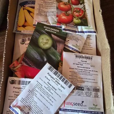 Yard / garden sprinklers and handtools with a bunch of vegetable seeds (some past the date)