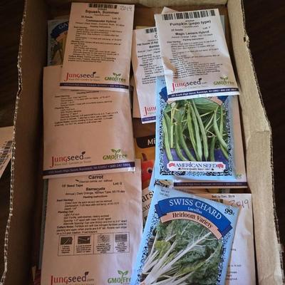 Yard / garden sprinklers and handtools with a bunch of vegetable seeds (some past the date)