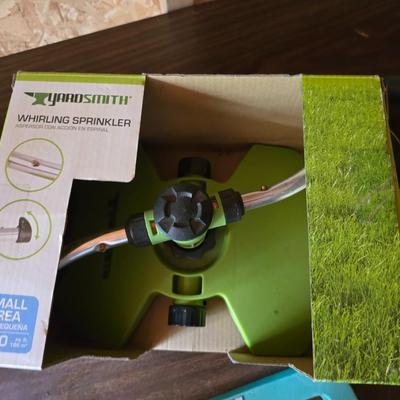 Yard / garden sprinklers and handtools with a bunch of vegetable seeds (some past the date)