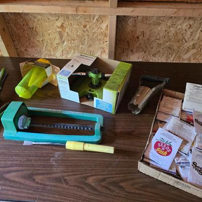 Yard / garden sprinklers and handtools with a bunch of vegetable seeds (some past the date)