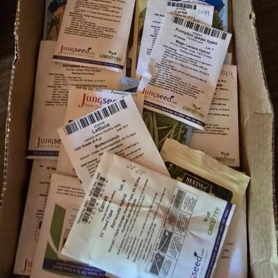 Yard / garden sprinklers and handtools with a bunch of vegetable seeds (some past the date)