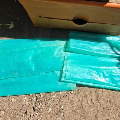 Three large orangish colored planters with tomato walls - self watering basin!
