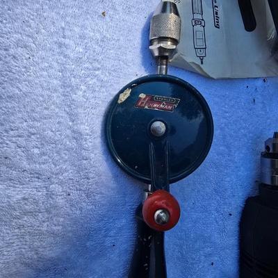 An Assortment of drills and tools, some newer, some vintage