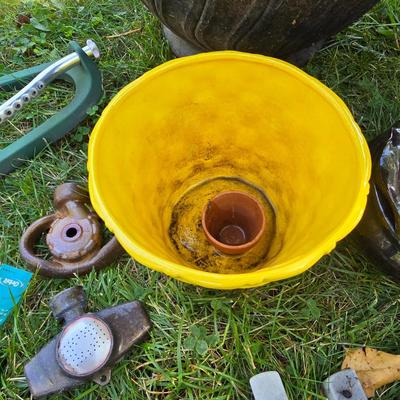 Flowerpots and Sprinklers with a brass plant stand