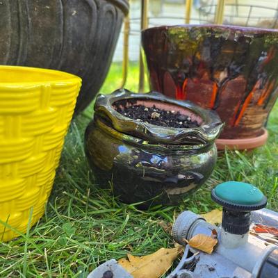 Flowerpots and Sprinklers with a brass plant stand
