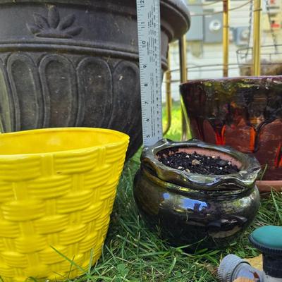 Flowerpots and Sprinklers with a brass plant stand