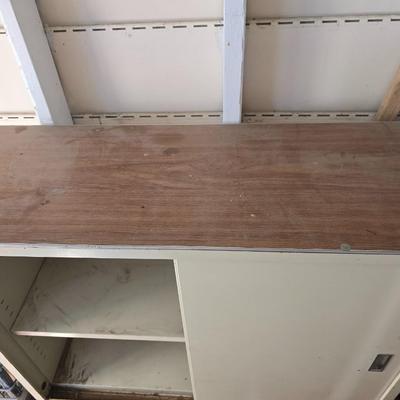 Metal storage cabinet with sliding doors