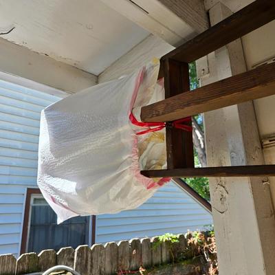 Antique wooden tripod with antique wooden ladder