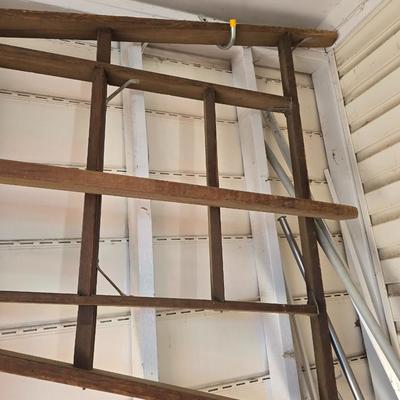 Antique wooden tripod with antique wooden ladder