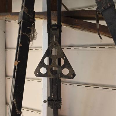 Antique wooden tripod with antique wooden ladder