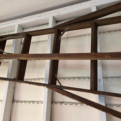 Antique wooden tripod with antique wooden ladder