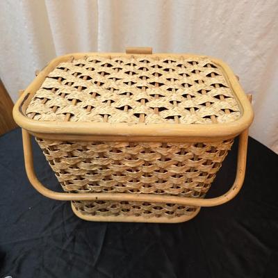 Wicker picnic basket with plastic plates - Melmac like plates - flatware and a can opener