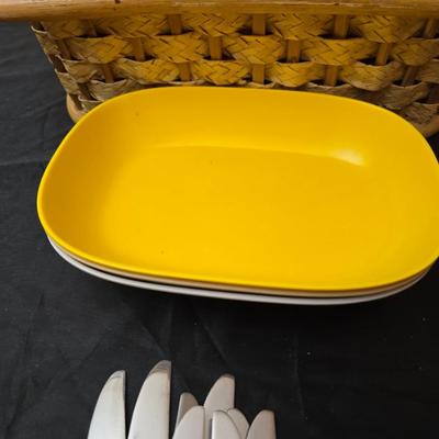 Wicker picnic basket with plastic plates - Melmac like plates - flatware and a can opener