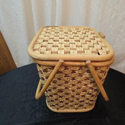 Wicker picnic basket with plastic plates - Melmac like plates - flatware and a can opener