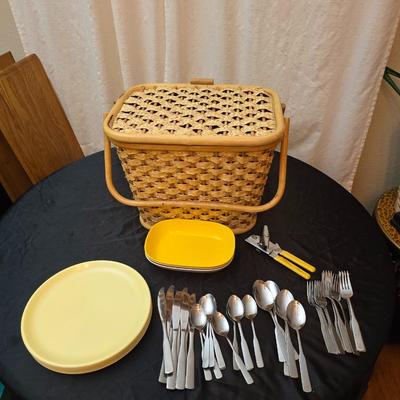 Wicker picnic basket with plastic plates - Melmac like plates - flatware and a can opener