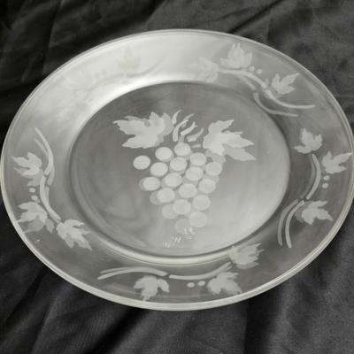 Etched rose and grapes glass plates with assortment of bowls and mugs