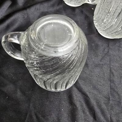 Etched rose and grapes glass plates with assortment of bowls and mugs