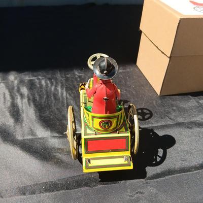 WIND UP MAN ON TRICK CART AND WIND UP TAXI CAB TOYS