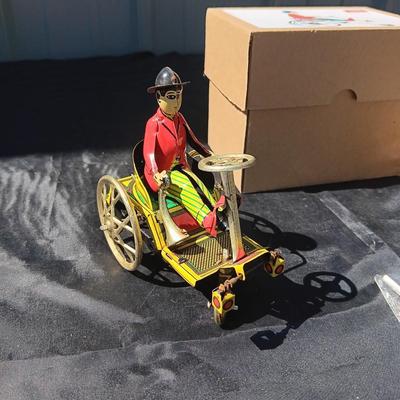 WIND UP MAN ON TRICK CART AND WIND UP TAXI CAB TOYS