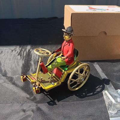 WIND UP MAN ON TRICK CART AND WIND UP TAXI CAB TOYS