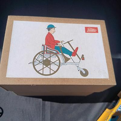 WIND UP MAN ON TRICK CART AND WIND UP TAXI CAB TOYS