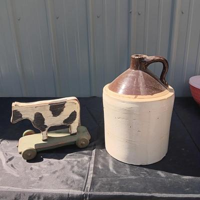 CLAY CROCK JUG AND WOODEN COW ON WHEELS
