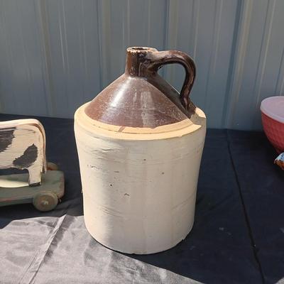 CLAY CROCK JUG AND WOODEN COW ON WHEELS