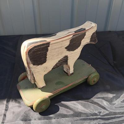 CLAY CROCK JUG AND WOODEN COW ON WHEELS
