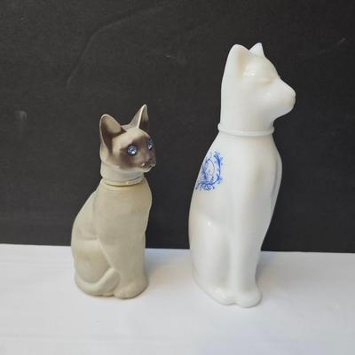 Avon Collectible cat cologn bottles and a cute cat tape measure - also Avon