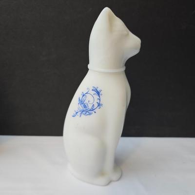 Avon Collectible cat cologn bottles and a cute cat tape measure - also Avon